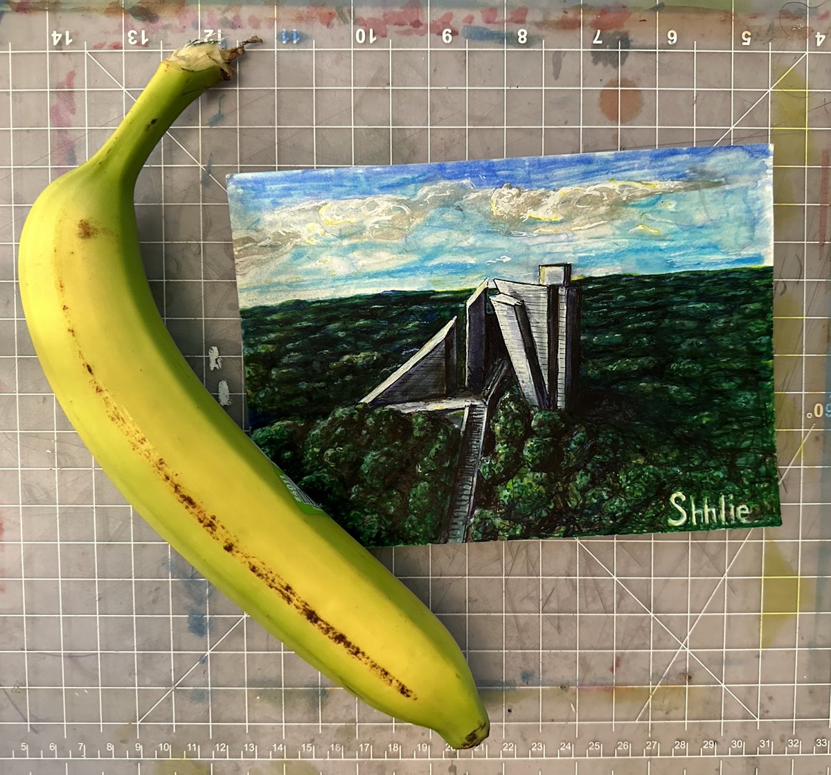 "brutal temple" brutalist bulgarian memorial serves as model  5"x7" mixed media. banana for scale. also, scale for scale.
