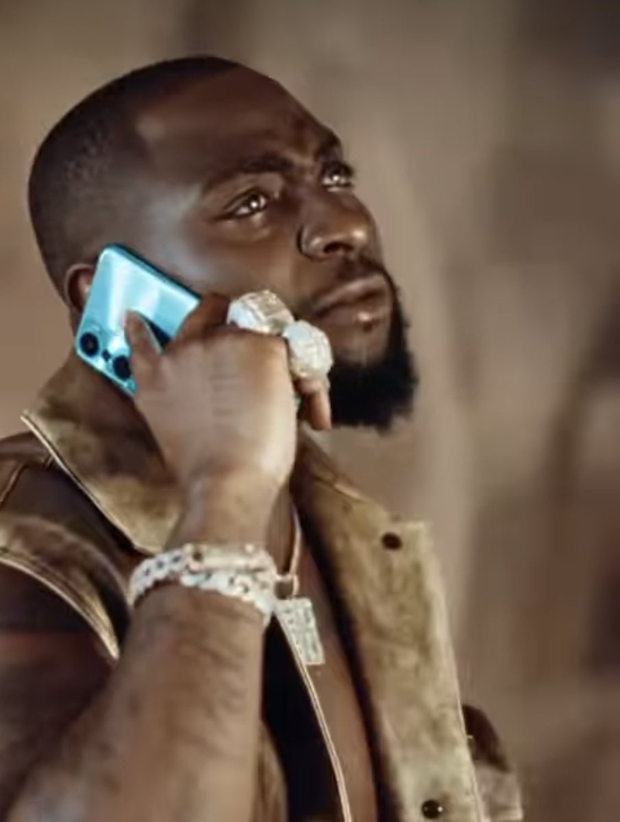 Dhavidote's tweet photo. Davido still sneaked in Infinix to the visuals of FEEL, proper ambassador🐐 https://t.co/1Wfup41aSW