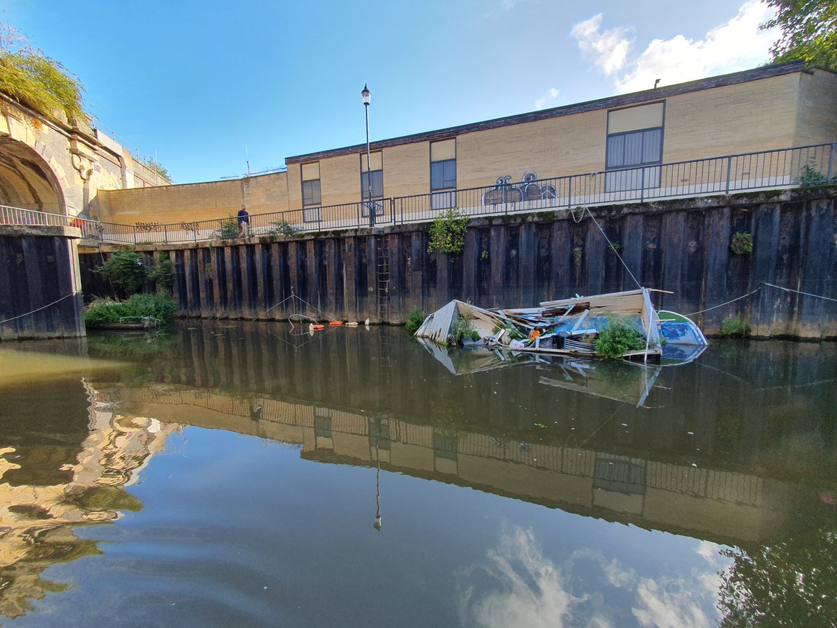 OriginalWild's tweet photo. I wonder when this boat will be removed from the River Avon in Bath, after months of being here? It's slowly falling apart, depositing rubbish into the river. So many people look at this from the bank, hardly the image Bath is looking for?

@bathnes @EnvAgencySW @EnvAgency https://t.co/CBr8pJw6Kr