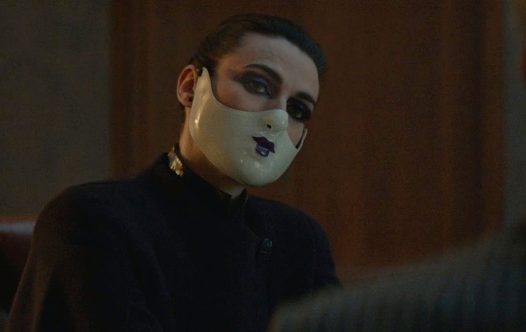 I've been so fixated on The Adjudicators face injury being something that happened to her as a punishment/injury, and we've come up with so many cool theories, but what if she was born with it? And her family made her wear the mask to keep their perfect controlled persona 🤔