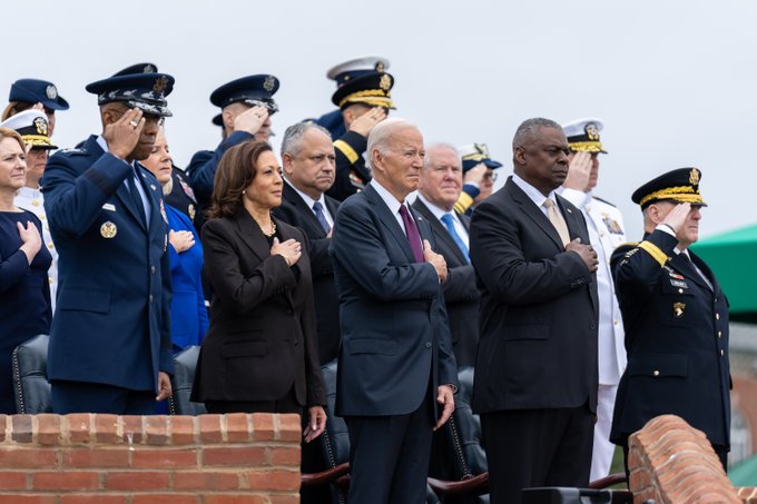 Gen. CQ Brown, Jr., Vice President Harris, President Biden, Defense Secretary Austin, and Chairman of the Joint Chiefs of Staff Gen. Mark Milley pause during the evocation during the Armed Forces Farewell Tribute in honor Milley and hail for Brown, the incoming chairman, at Joint Base Myer-Henderson Hall.