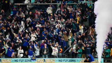 Fans in J-ROD Squad celebrate a home run.