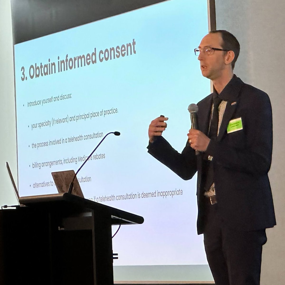 ACMAVic's tweet photo. Dr Owen Bradfield from MIPS makes the ultimate sacrifice of talking about #Telehealth during the @AFL #AFLGrandFinal — and the audience is dedicated enough to stay! #ACMAV2023 https://t.co/3tDZaPlYz6