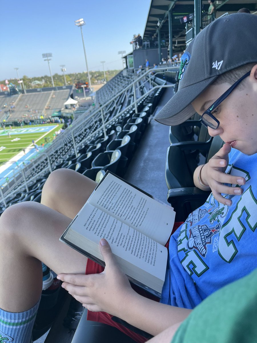 Pre-game reading time! This week’s selection prior to @GreenWaveFB vs UAB: the third and final installment in #TheFourthStall by @chris_rylander. #MGBookChat #MiddleGradeReaders #RollWave🌊