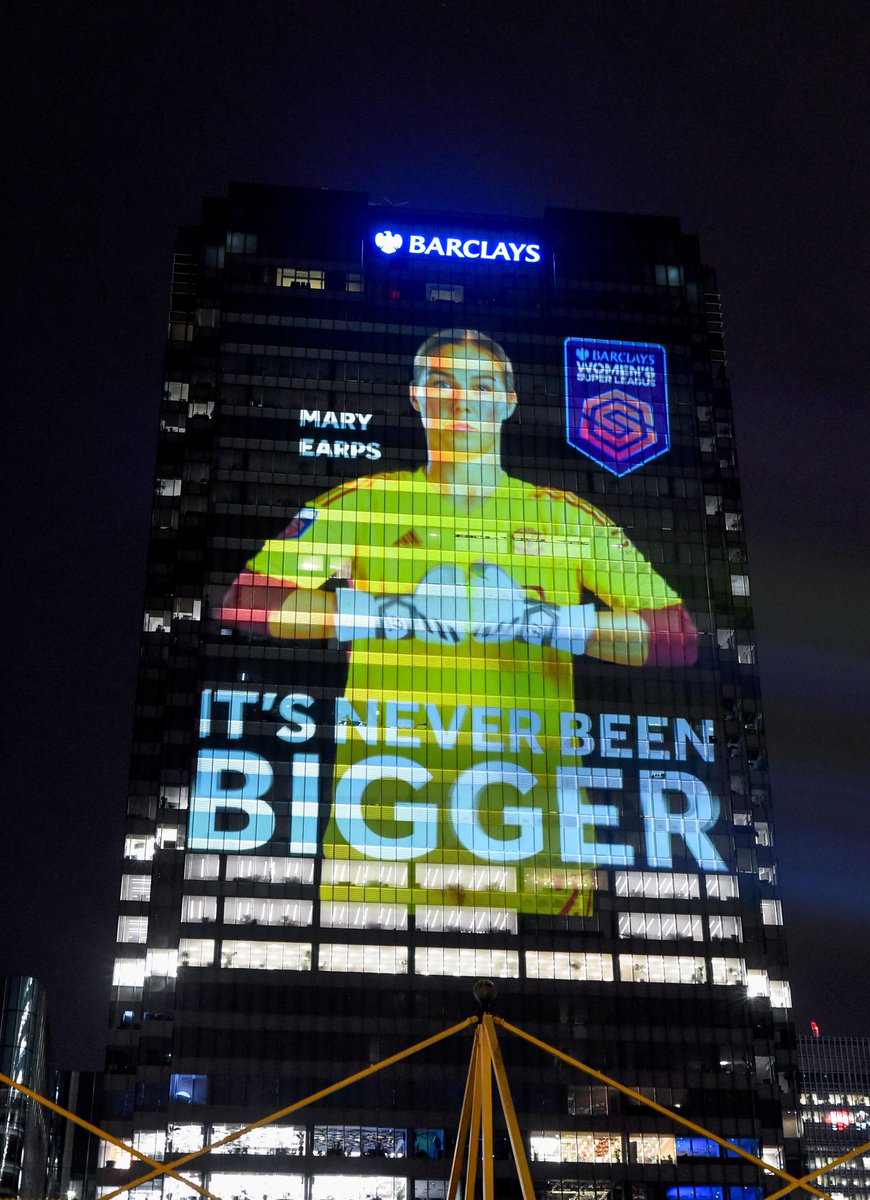 BarclaysCIB's tweet photo. Ahead of the match kicking off the 2023-2024 #BarclaysWSL ⚽ season, we lit up Barclays HQ in 📍 Canary Wharf with pictures of 12 female athletes, projected to 18 stories, honouring them as the giants that they are on the football pitch. https://t.co/QCargFWgCC