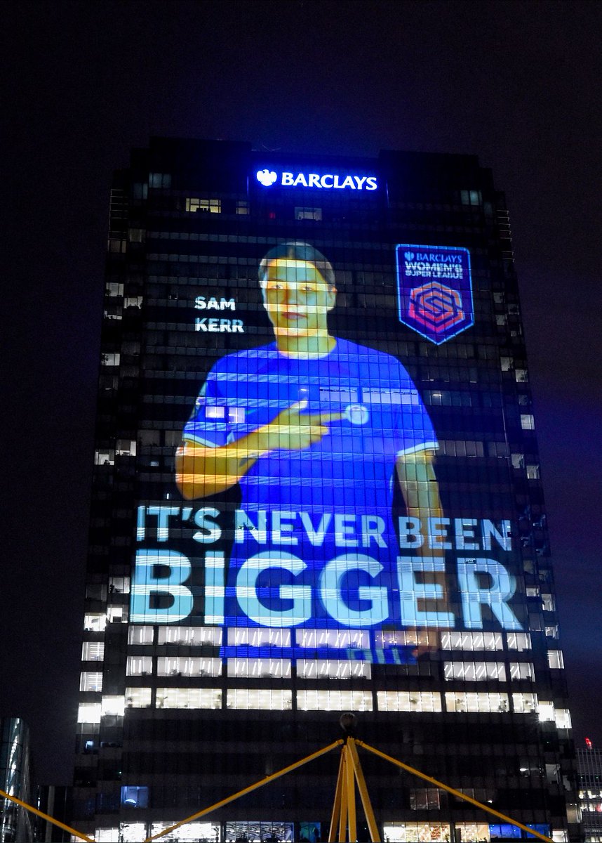 BarclaysCIB's tweet photo. Ahead of the match kicking off the 2023-2024 #BarclaysWSL ⚽ season, we lit up Barclays HQ in 📍 Canary Wharf with pictures of 12 female athletes, projected to 18 stories, honouring them as the giants that they are on the football pitch. https://t.co/QCargFWgCC