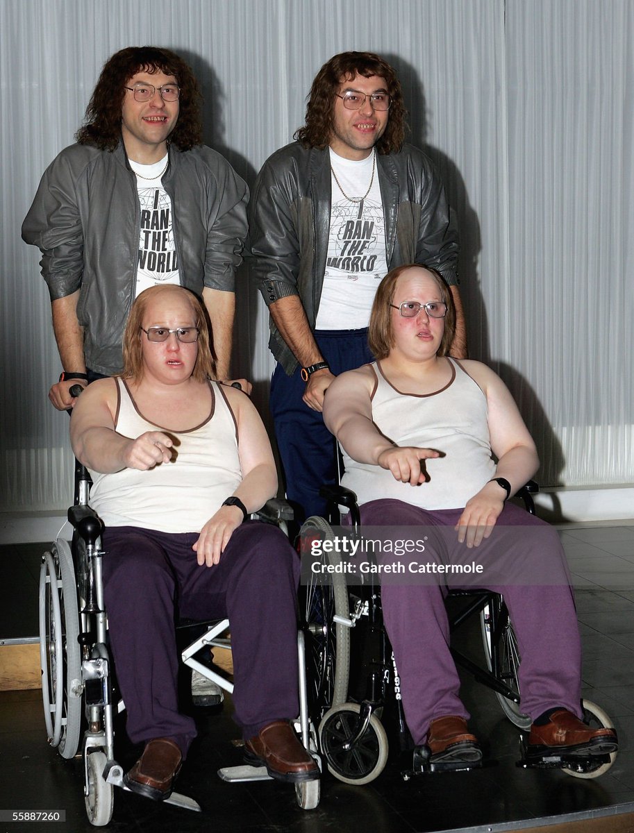 Actors Matt Lucas (front right) and David Walliams (back right) unveil the wax models of their characters wheelchair-bound Andy and his carer Lou from the cult comedy series Little Britain at Madame Tussauds in London, England (2005)