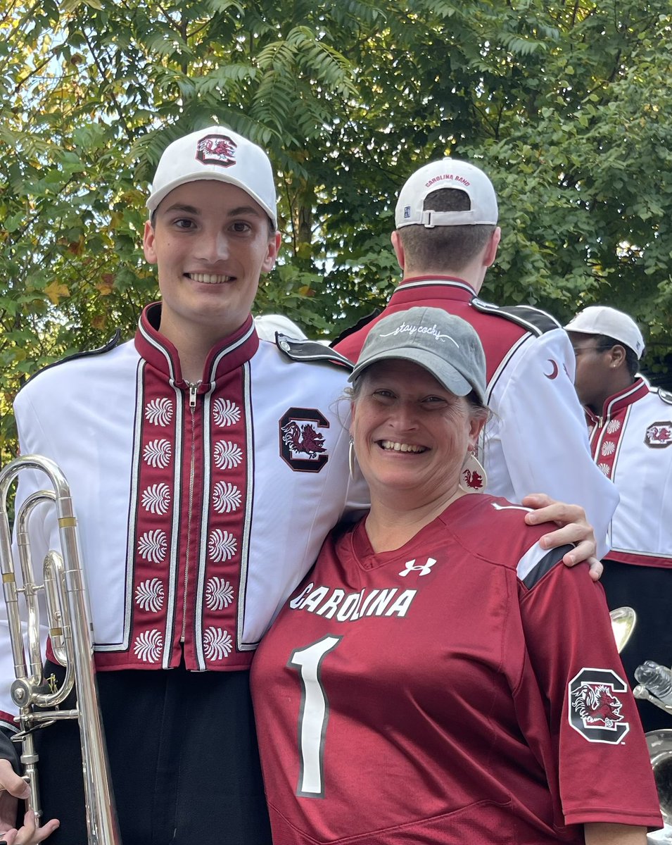 Erin_Hand_6_11's tweet photo. I don’t even have the words for how proud I am of this kid. I love that he didn’t seem upset that I LITERALLY YELLED “I love you!” when he was in block - then other trombones jumped in &amp; said “get with him we will take a picture!” Seeing THIS big smile lights up my world! ❤️🖤🤙 https://t.co/QwGpkftFHz