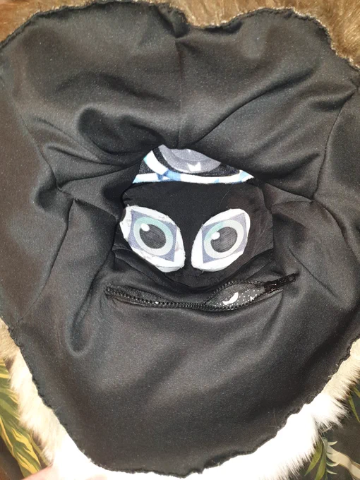 hims almost finnished. just needs finnishing toyches like tongue , teeth and and a finnish to thr hand paws. he features velcro ajustable straps and a neck pocket! i think all future suits of mine will have them. 