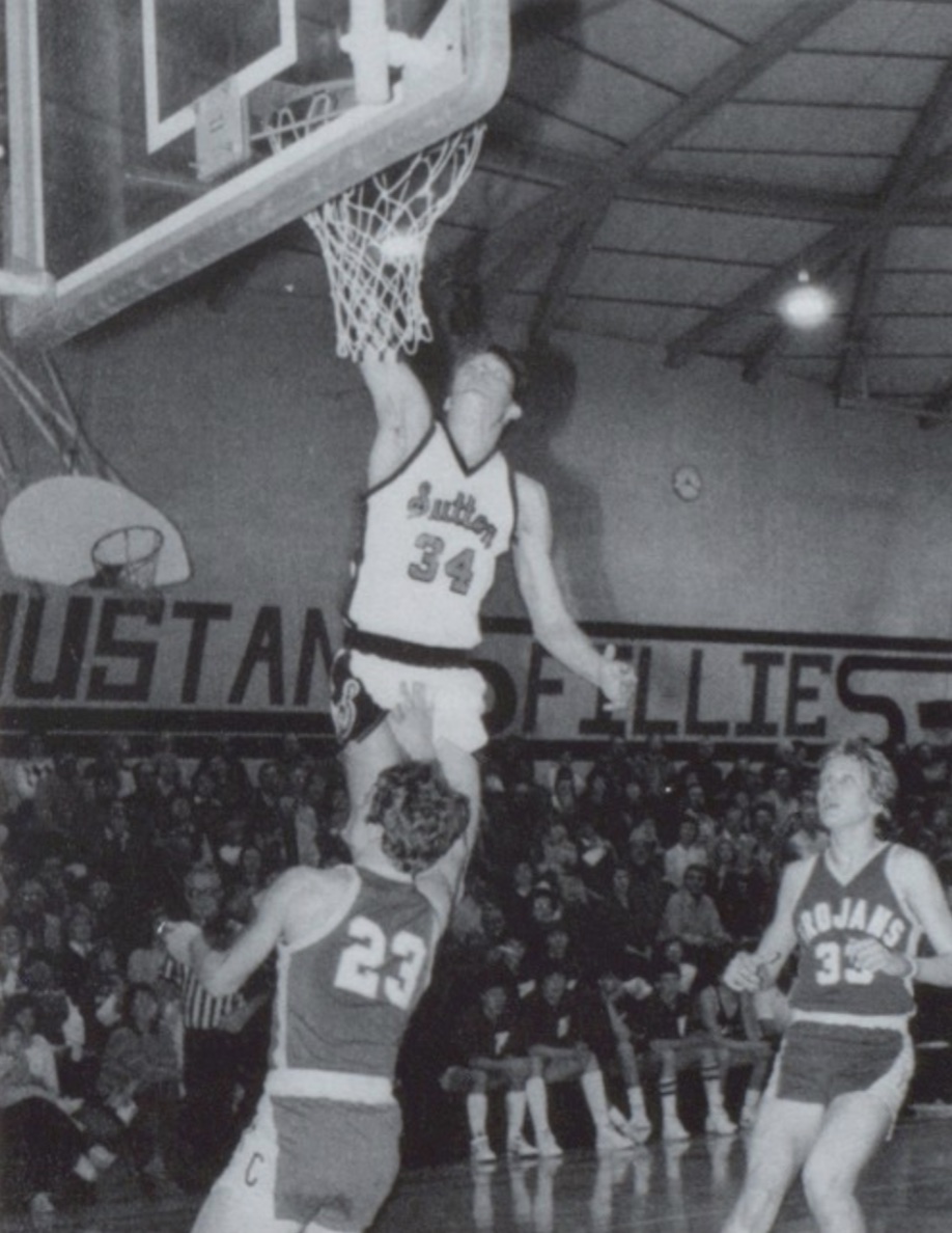 Sutton two-time all-stater Scott Scheierman flies high over a pair of Tri County opponents in 1985.