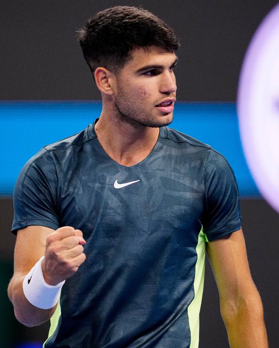 Carlos Alcaraz celebrates with a fist pump after winning the opening set against Lorenzo Musetti in the second round of the China Open.