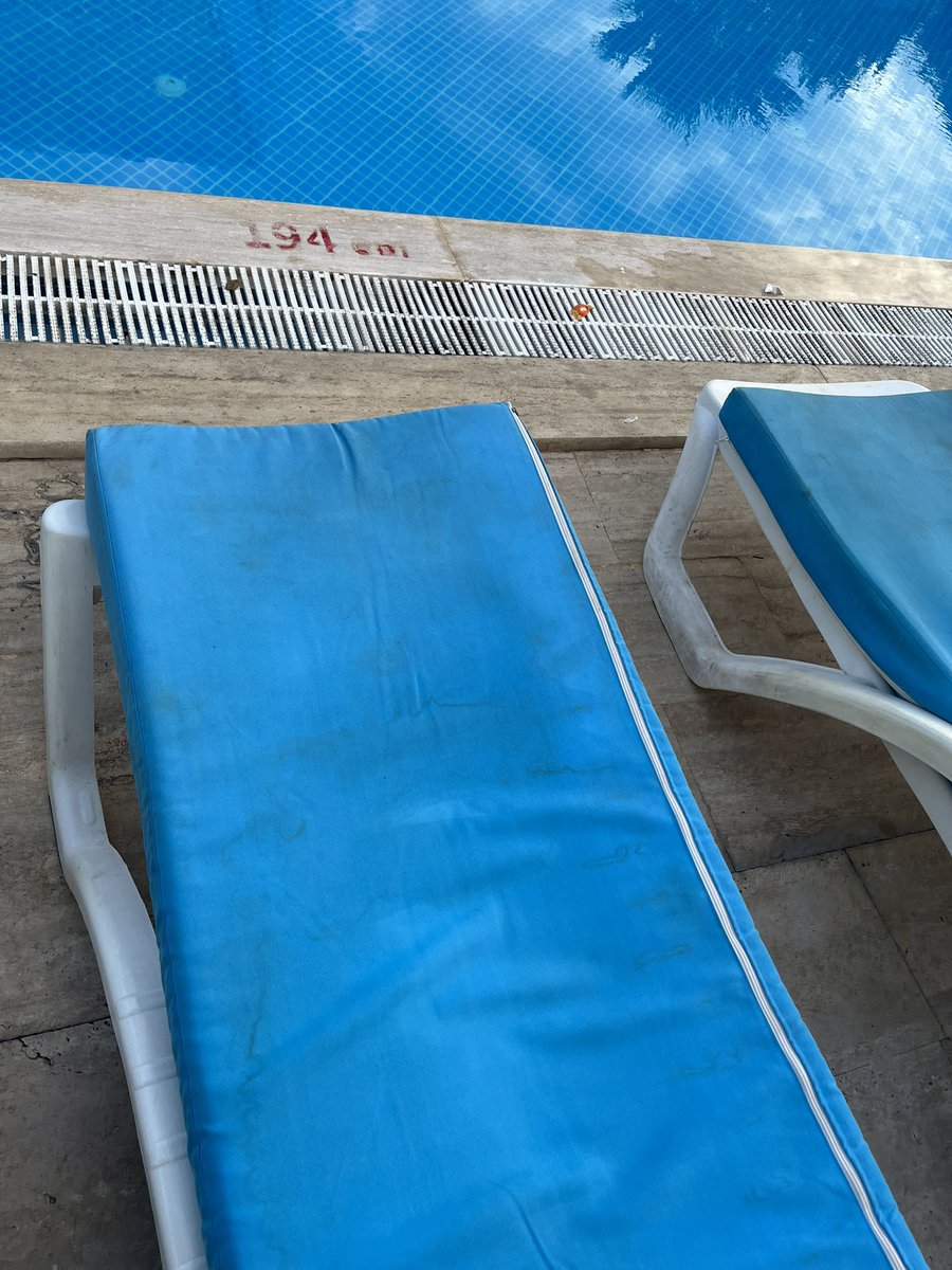 JoBoxall's tweet photo. @TUIUK arrived at a FILTHY and oversold hotel in Bodrum last night and not a rep to be seen. Rang your ‘help’ line to be told they would ‘try’ and get someone to ring… would you lie on one of these sunbeds covered in dirt, sweat and hair? https://t.co/HDYA0sf2RP