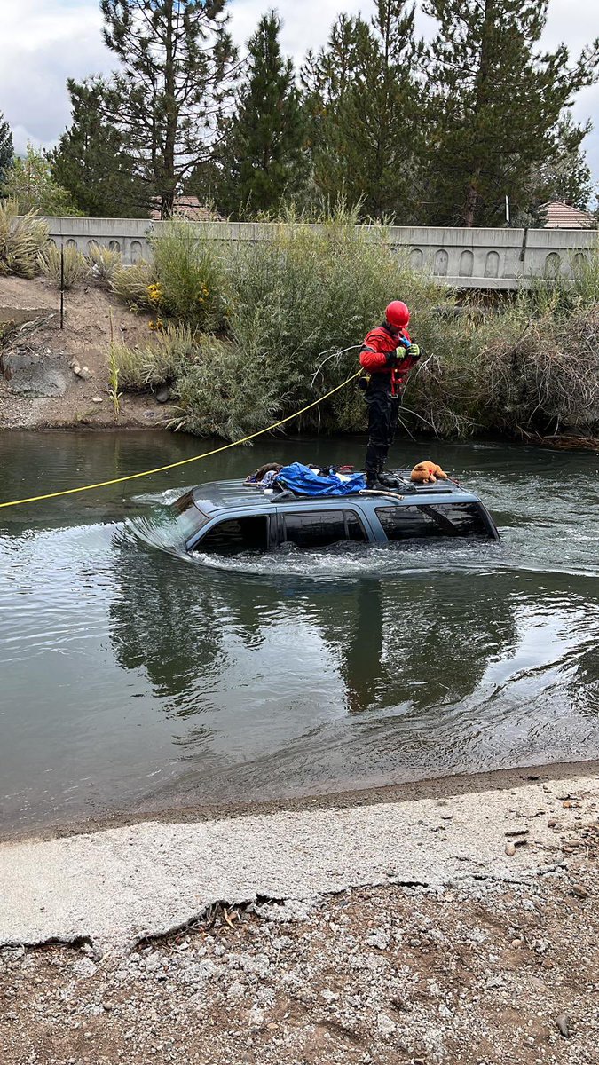 TMFPD's tweet photo. #TMFR responded to a trapped vehicle in canal in Verdi earlier this morning. Uninjured single occupant escaped prior to high water. Fire crews coordinating with @WashoeSheriff and @NNPH_Org on vehicle recovery. https://t.co/M8vV3faZeV