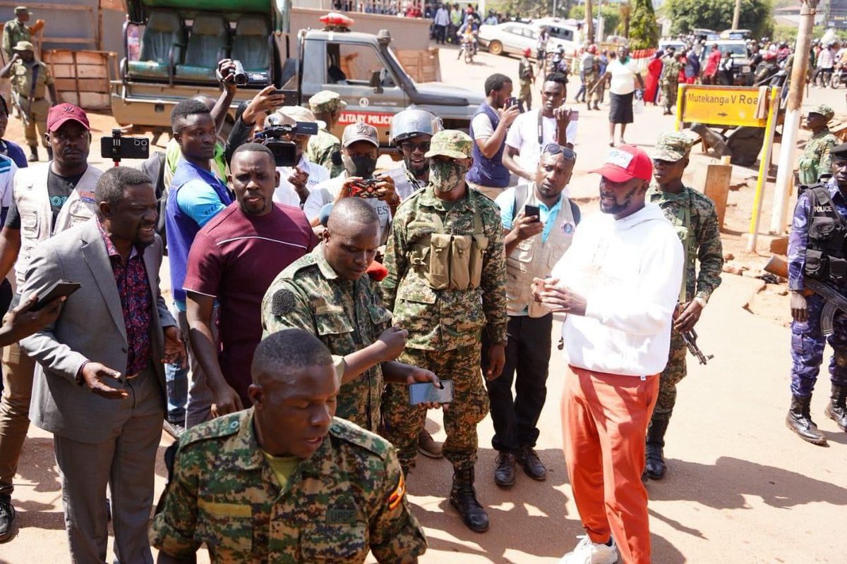 MathiasMpuuga's tweet photo. The military siege of our party headquarters & the arrest of our Secretary General @DavidLRubongoya and Spokesman @JoelSsenyonyi speaks volumes about our country's democratic credentials. 
This happening on a day when the country is supposedly celebrating its 61st Independence Day only shows that we are still under colonialism - it's only the colonisers skin colour that changed.