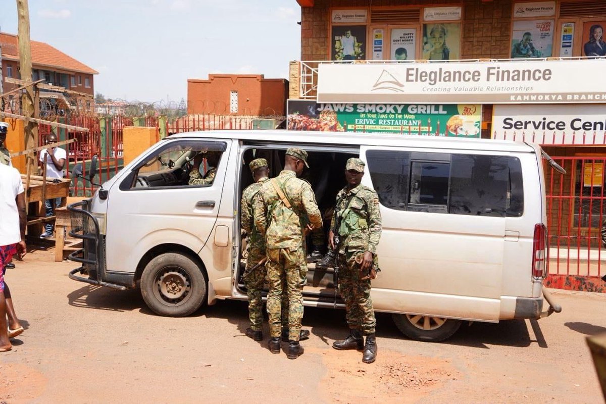 MathiasMpuuga's tweet photo. The military siege of our party headquarters & the arrest of our Secretary General @DavidLRubongoya and Spokesman @JoelSsenyonyi speaks volumes about our country's democratic credentials. 
This happening on a day when the country is supposedly celebrating its 61st Independence Day only shows that we are still under colonialism - it's only the colonisers skin colour that changed.