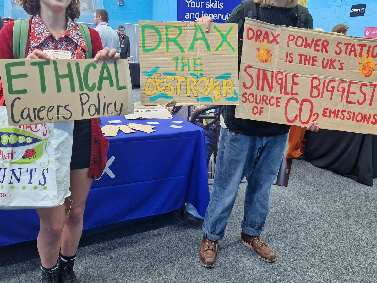 srleeds_'s tweet photo. We're at @UniversityLeeds careers fair to greet @DraxGroup, whose power station is UK's single biggest carbon emitter. Drax receive millions in energy subsidies from the gov because they greenwash biomass (burning trees!) as renewable, despite clear evidence that it is not! (1/3) https://t.co/8Lk82CPQCp