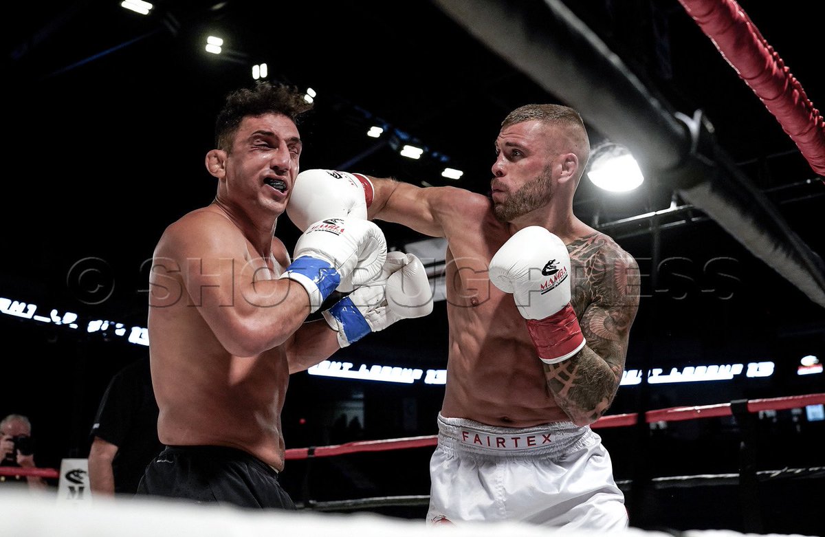 Alireza Jadidi (black shorts) gets a right hook from Phill Engeroff at the Mamba Fight League 13, at the Langley Event Centre, September 29, 2023. Photo: Wes Shaw/ ShotBug Press @wesleyallenshaw @fitetv <a href="/shotbug/">Shotbug™ Press (We get the shot!)</a>  @mamba_fight_league More photos at press.shotbug.com/p655680279