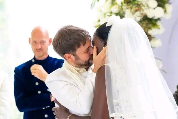 In this Omosh and Akothee wedding pic, that guy behind them, knew something