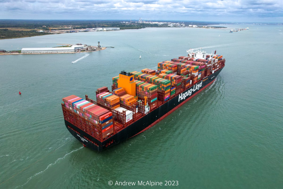 Maritimegeek's tweet photo. Over the weekend @HapagLloydAG newest boxship #ManilaExpress made her maiden visit to the port of #Southampton she is the second vessel in a class 12 new dual-fuel vessels with a capacity of 23,664 TEU. She is seen here passing Calshot. #containership #dronephotography https://t.co/ff7H204Iuh