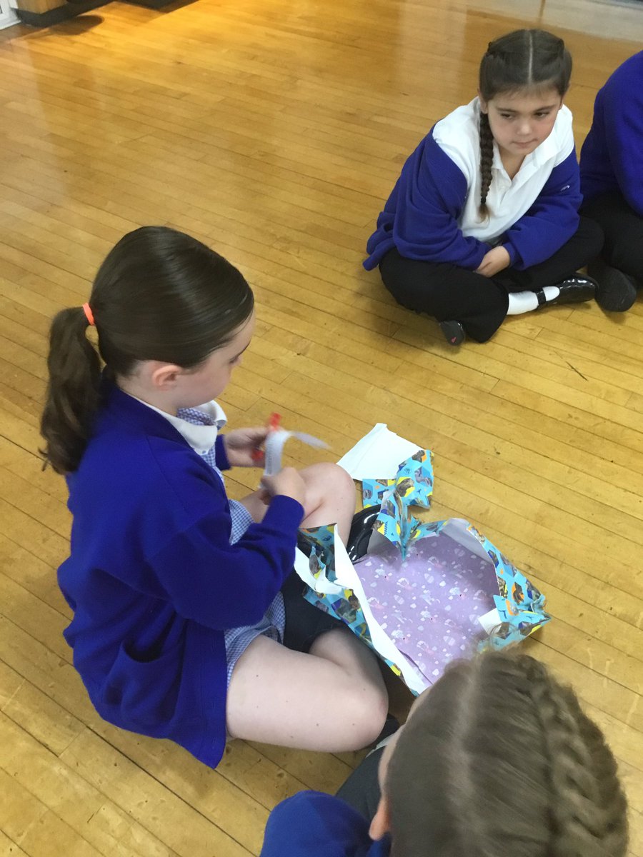 LeysFarm's tweet photo. Year 4 played ‘prediction pass the parcel’. Their new class story was wrapped up and each layer contained a clue, quote or picture. When the music stopped, they unwrapped a layer and read out the clue! They enjoyed making predictions and connecting the clues together!#LFJSReading https://t.co/VtbHJNuBZ3