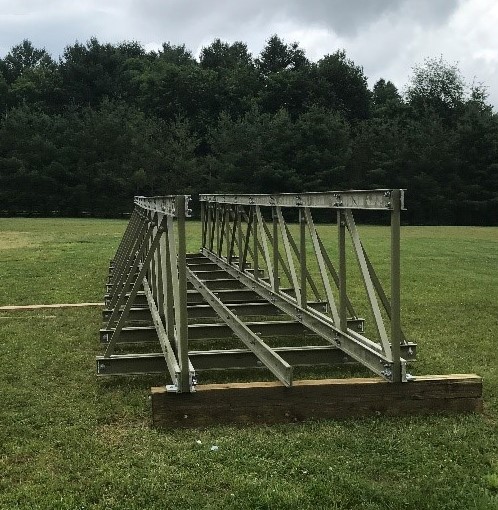 strongwellmc's tweet photo. This week's project focus is on a community pedestrian bridge. #madeinusa #SAFDECK and #EXTREN were both used to construct a bridge over a pond. #Fiberglass beat out lumber due to leaves and proximity to water. https://t.co/vZwsTVgD2i #pultrusion #composites https://t.co/X7AlYyQKq2