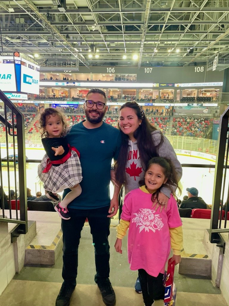 AlsPalsMoncton's tweet photo. The Ouazzani family, originally from Morocco, had an absolute blast at their first ever hockey game. They already looked at the @monctonwildcats schedule to plan their next one! https://t.co/4uZqyMzrhs
