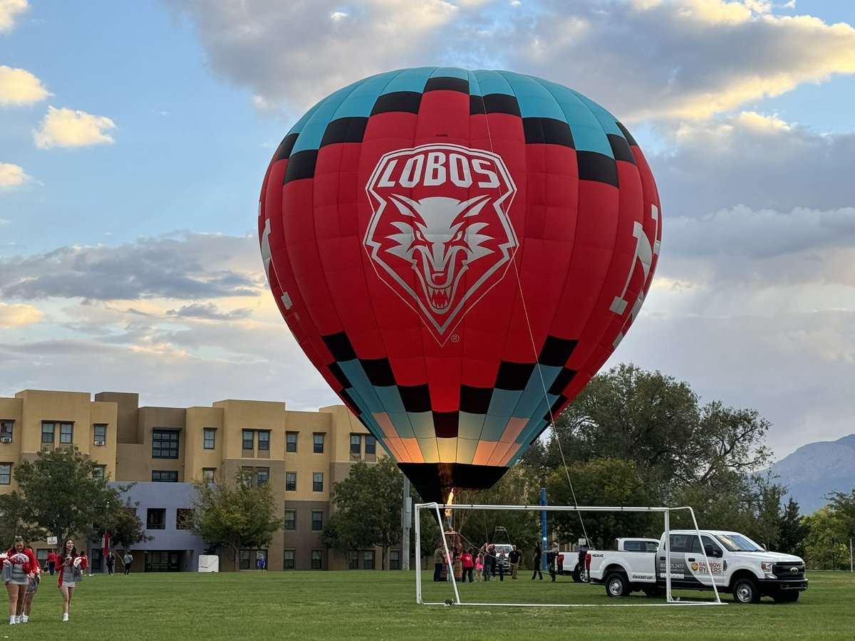 ProfBenavidez's tweet photo. UNM debuts “Cherry on Top,” their new hot air balloon featuring the school’s institutional and athletic logos.  🍒🔥 https://t.co/TKGNXdrBcD