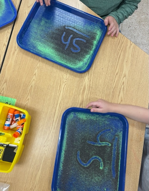 We've been loving using our sand trays in Phonics First to review consonant and short vowel sounds as part of our daily three part drill! #WeAreChappaqua #WOschool