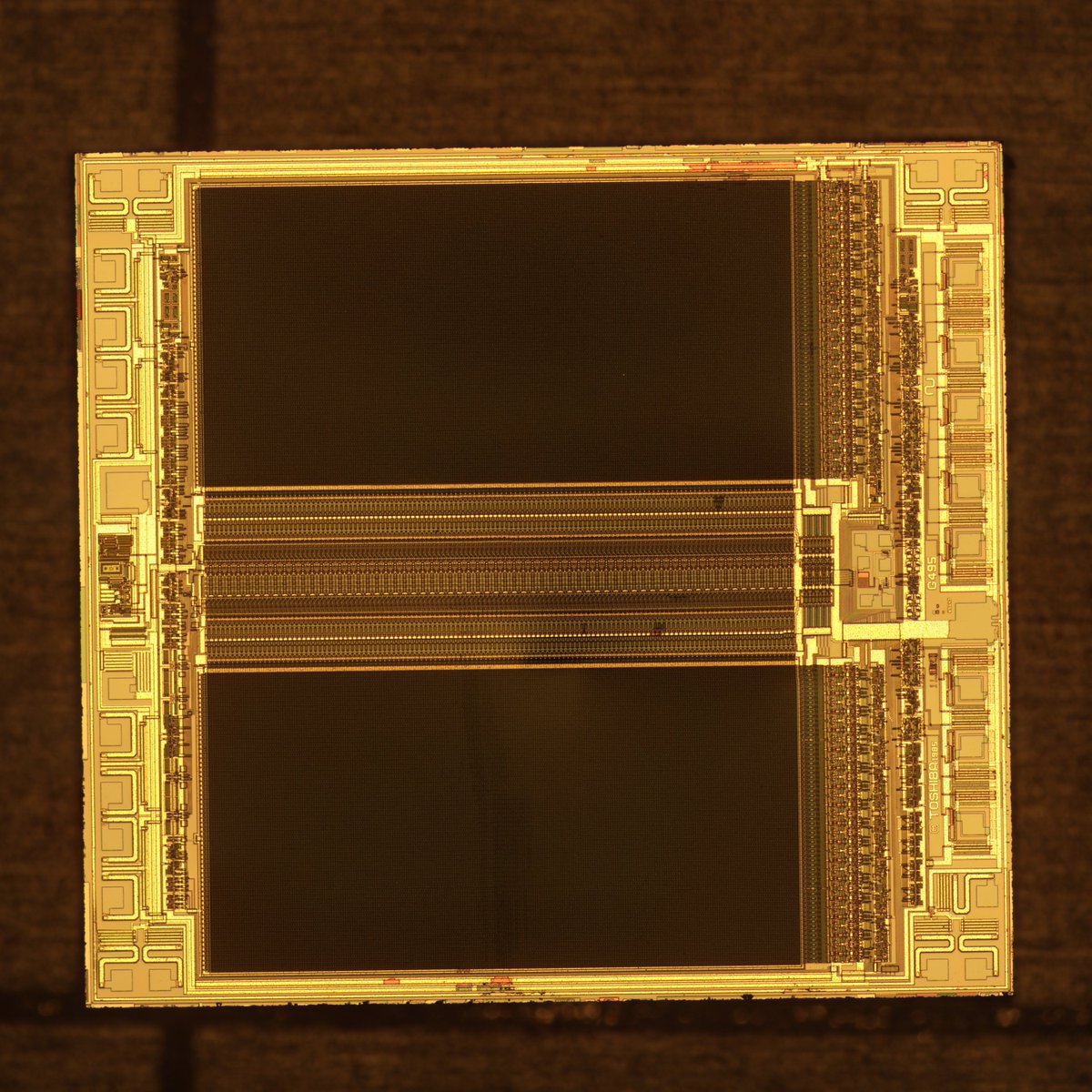Toshiba TC54256 from a <a href="/TICalculators/">Texas Instruments Education</a> TI 81 graphing calculator. This is an OTP ROM, an EPROM with no quartz window for erasure. You can read it electrically with a standard reader, but you won't be photographing the bits with an optical microscope like a mask ROM.

cc <a href="/ticalcorg/">ticalc.org</a>