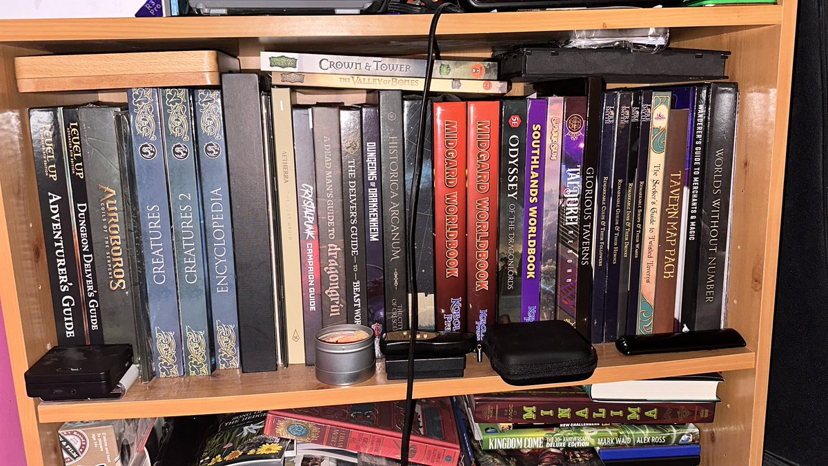 TSGamingUK's tweet photo. @HungryScribbler Currently in bed next to one of my #DnD shelves, so these are all equally close to me! 😅 https://t.co/SRxo50yrEJ