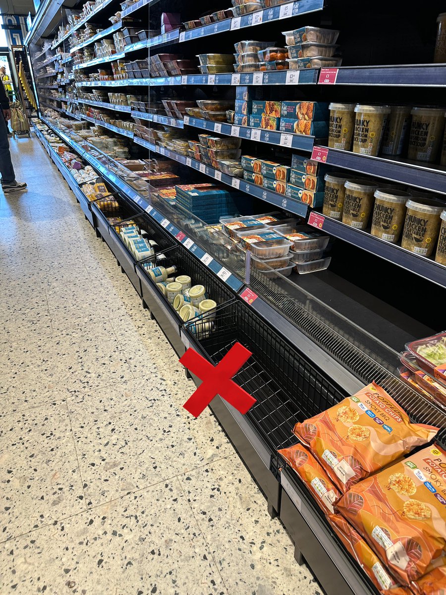 phoebemonkey's tweet photo. Hi @marksandspencer - I’ve noticed you’ve started adding these baskets at the bottom of coolers in some of your food halls. 

They make it SO much harder to reach items as a wheelchair user. Could you please stop doing this? https://t.co/ZkxZQ4cF2E