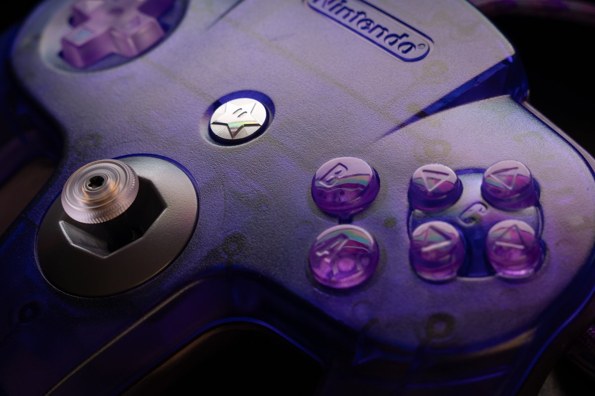 gamrjerome's tweet photo. Finished this #n64 controller build
Shell: Grape+Atomic
#TaoStyx64 Nylon Stick & Grade A MP-100 Bowl
#steelsticks64 Purple Thumb Pad & Metal Star Start Button
@RockerGameMod Clear Buttons "Rear Painted Light Purple" & LR + Z Tactile Switches
8ft "Purple Blend" 550 Paracord https://t.co/0bijGkixuX