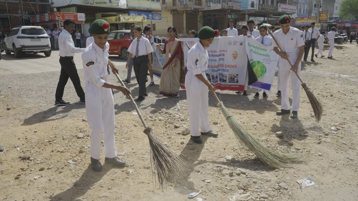 NIMS_School's tweet photo. NIMS International School's NCC cadets assumed a crucial role in the "Ek Ghanta, Ek Tarikh" cleanliness awareness campaign, actively championing hygiene throughout our campus while underscoring the significance of a pristine environment. 
#NIMSSchool #NCC #SwachhBharat https://t.co/h2LgSEVf7J