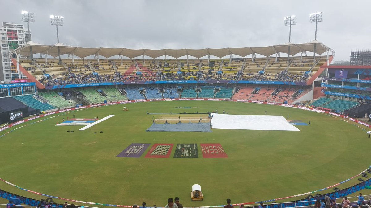 pru280302's tweet photo. Some bad news, it has started to drizzle and the covers are back in place. Umpires out with umbrellas talking with the head groundsman

#ICCCricketWorldCup #CricketWorldCup2023 #INDvNEP #CWC23 #IndiaAtAsianGames #INDvsNED #thiruvananthapuram https://t.co/31gPucEnzE