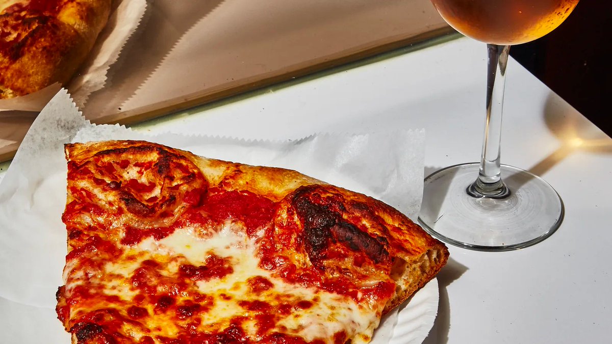 The first time I visit Scarr's Pizza, I almost walk right past it. From the outside, it could be any of the thousands of old-school slice joints that dot the city, complete with the classic red-and-blue bubble-lettered sign capped with a phone number