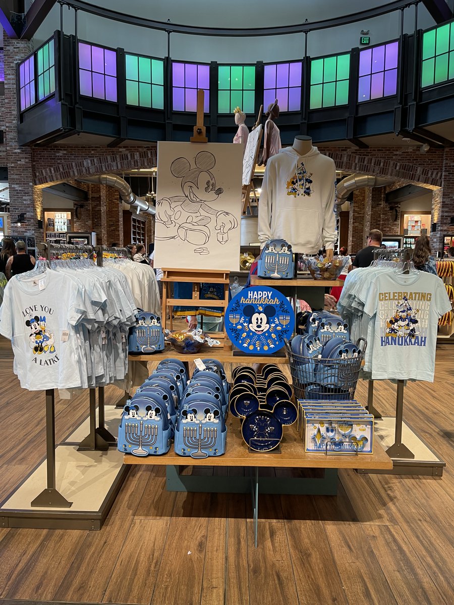 carlyewisel's tweet image. a friend sent me a photo of the Hanukkah display from World of Disney at Disney Springs. 

merchandise featuring all of the characters!
themed backpacks!
something new and fun to buy!
finally!!!!!!!!!!!!

thank you to every cast member who helped make this happen!!!!!!!!