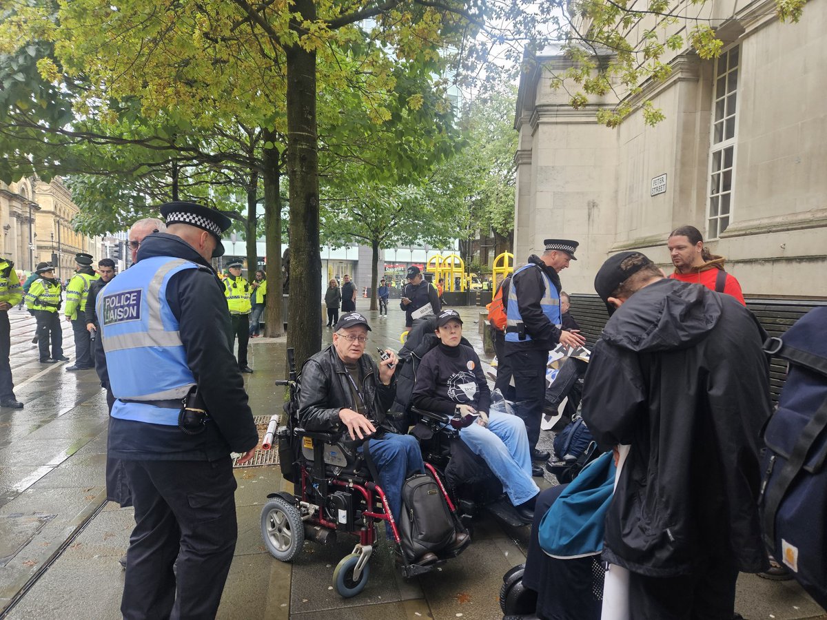 lumnic's tweet image. Greater Manchester police trying to stop a Disabled People Against Cuts protest from taking place outside the Tory party conference, threatening to move people on! Solidarity with @Dis_PPL_Protest today and always!