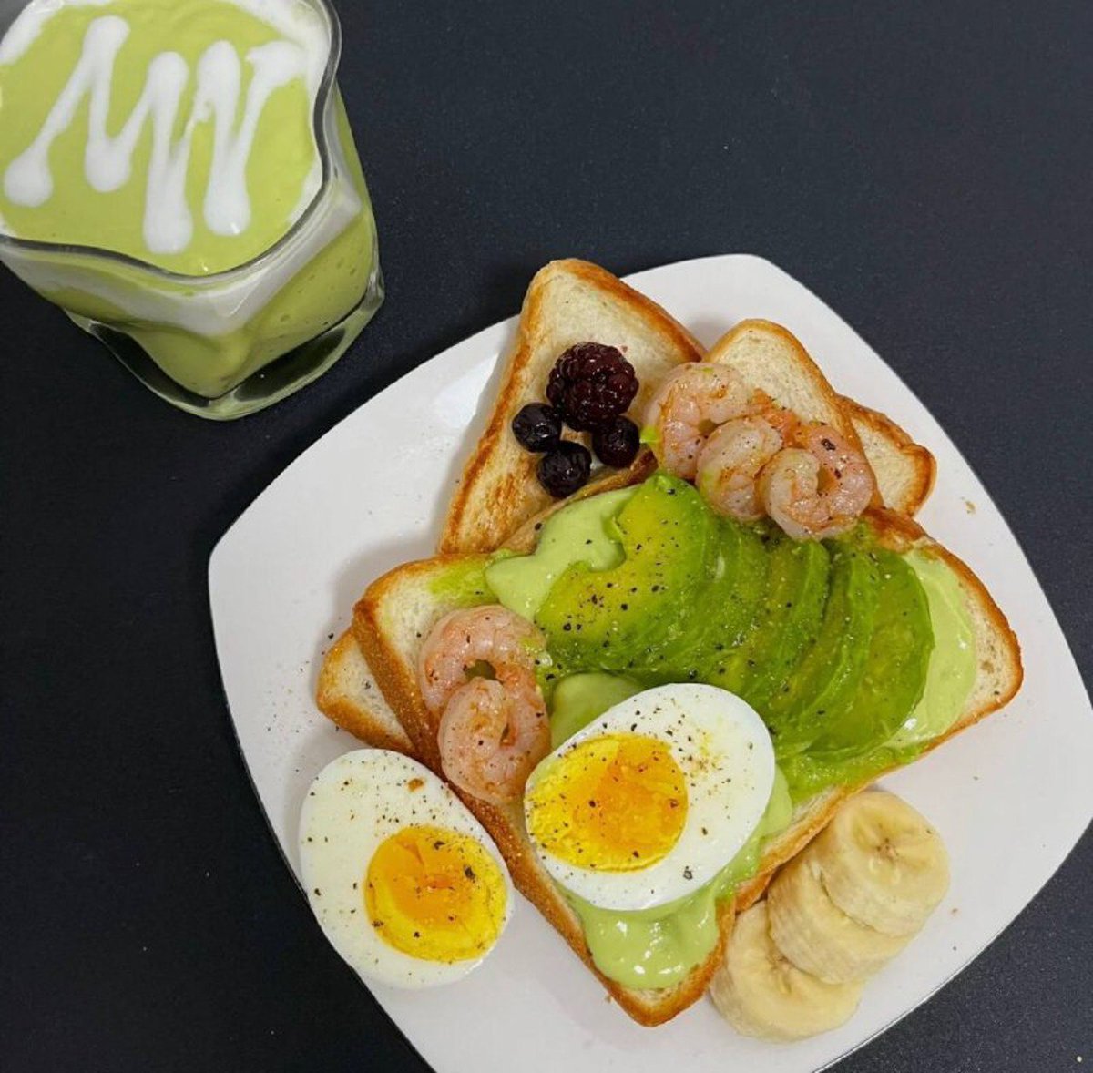 Breakfast eggs, avocado, toast, banana, shrimp and avocado smoothie #yummybreakfast #healthy