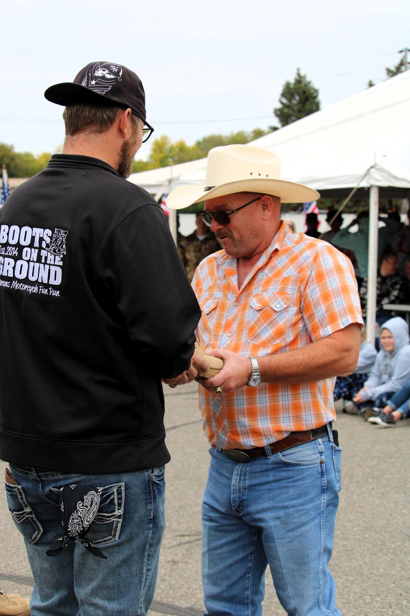 WeDriveCFI's tweet photo. Join us in saluting Professional Driver and Veteran Remy who was honored at the #BootsOnTheGround Motorcycle Fun Run Ceremony in #Underwood, MN. Remy drove his #TruetotheTroops wrapped truck in the parade &amp; he was recognized with eight fellow Veterans and active service members. https://t.co/SQtTpi56c6