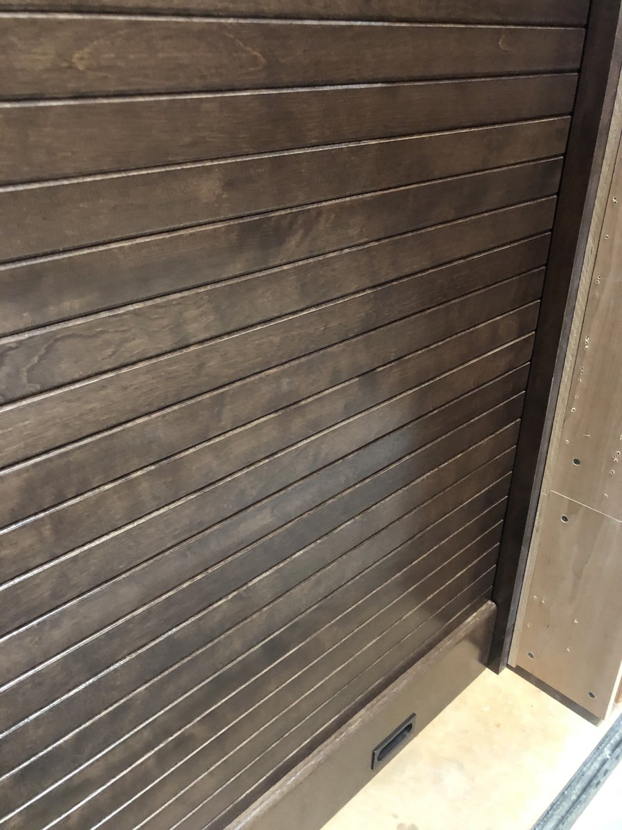 One of the most narrow doors we’ve manufactured a beautiful custom stained maple hardwood roll up door for a closet