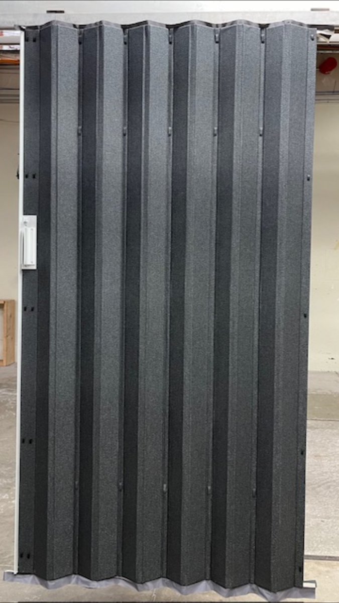 The beauty of a sleek acoustic accordion partition is so easy to see here. A dark and textured finish, coupled with a 31STC maintains a contemporary look and gives a modern twist. www.woodfold.com/cvp/