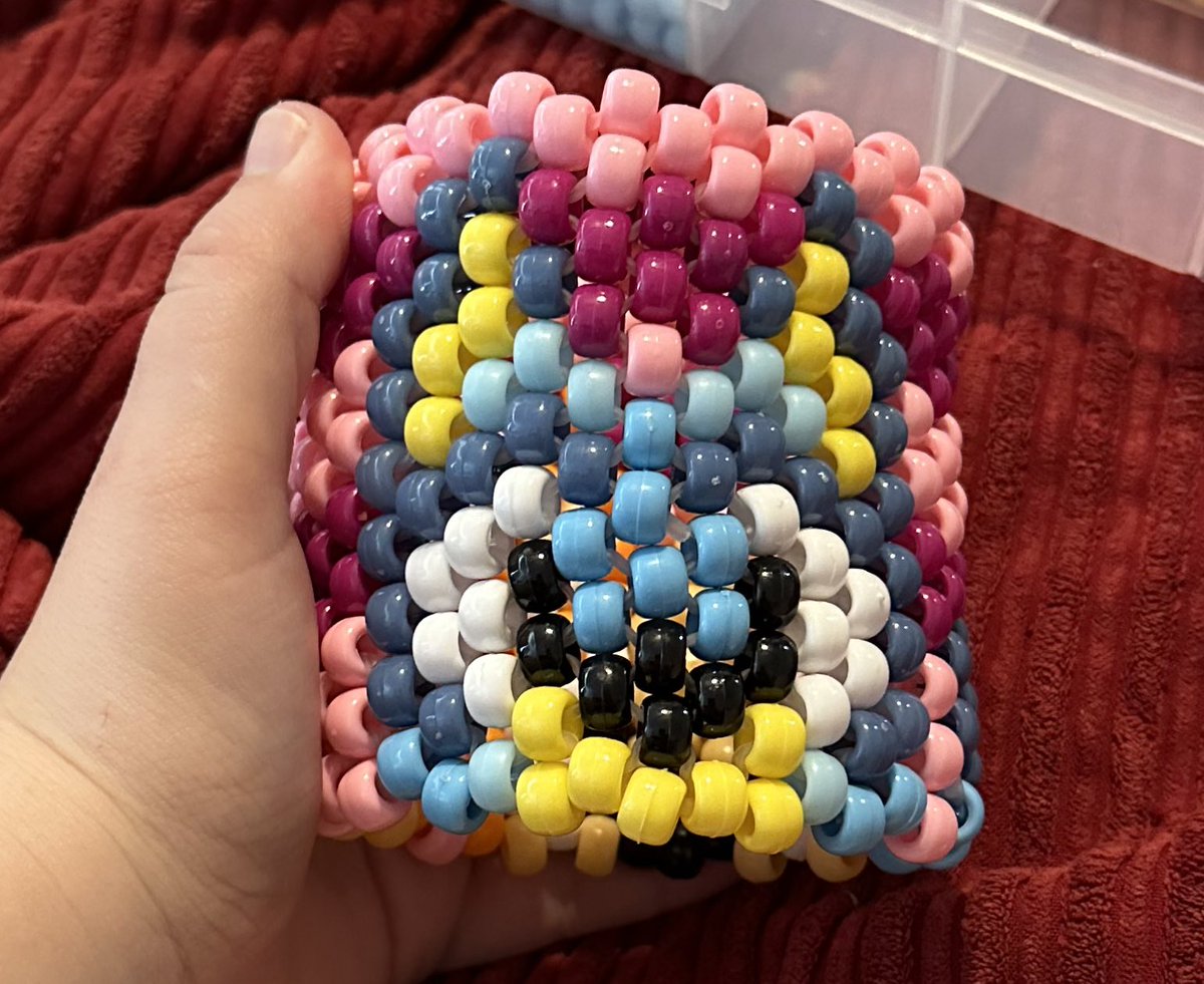 skittlezthewulf's tweet photo. Kandi game on point! Learned how to read cuff patterns, now I’m obsessed! Made a possum, and a bluey/bingo cuff. Working on another Bluey/bingo rn 😂 #furry #kandi #furries #art #kandicuff https://t.co/q6wIcnDA6I