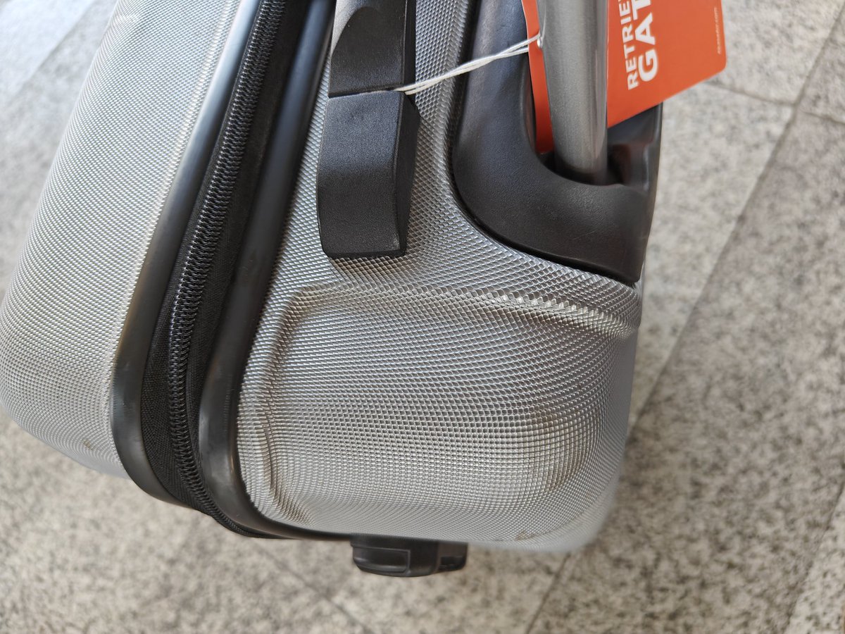 Ashawari14's tweet photo. @AkasaAir such manhandling of my luggage!!! My handbag was taken from me at the boarding gate saying the flight was full and they would put it as check-in luggage. But my bag was handled with absolute negligence! There are marks all over and the handle is wobbling!! https://t.co/z5tY6zlkFc