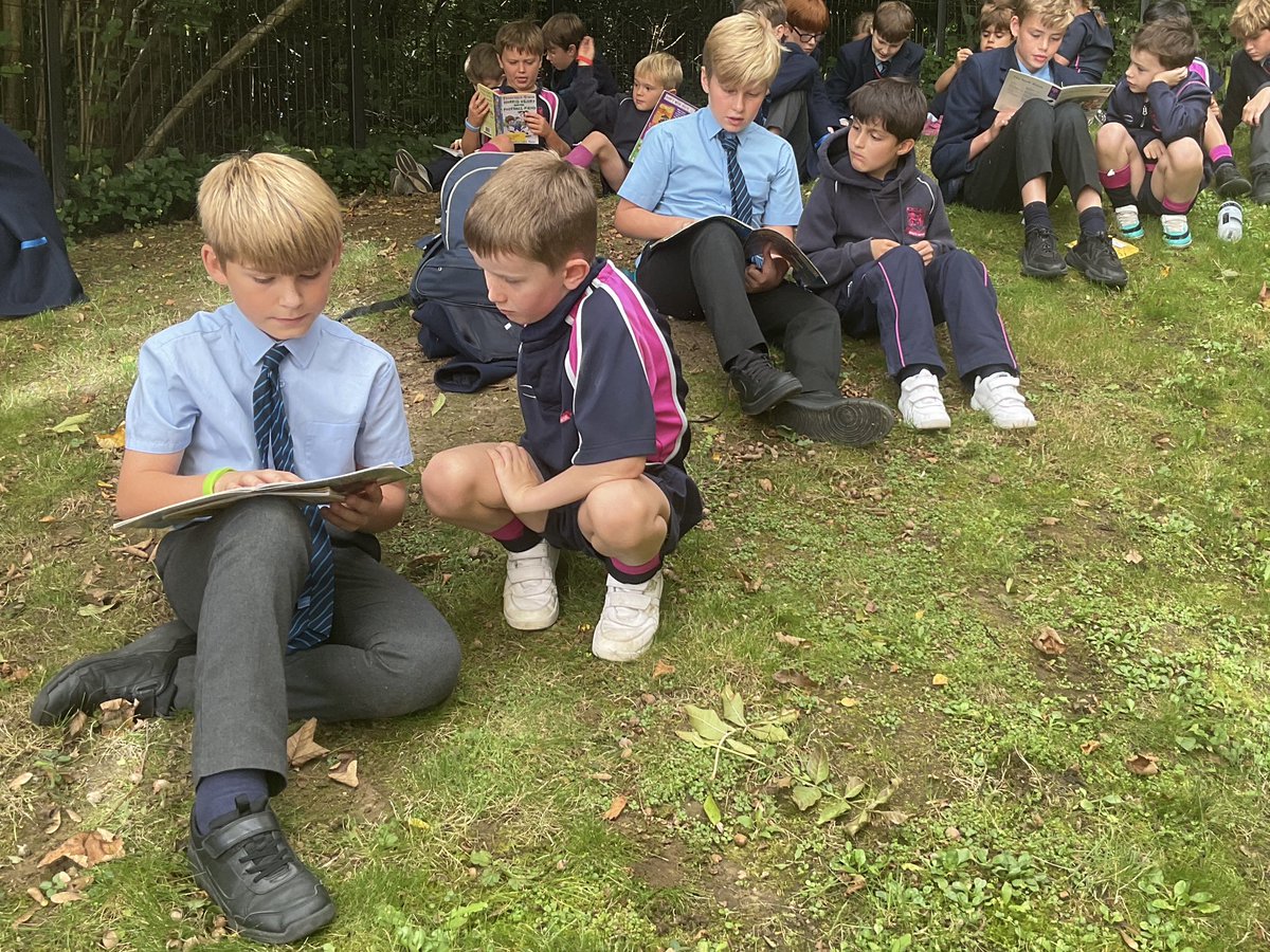 HWD_Upper's tweet photo. Year 7 are being brilliant role models as they meet up with their buddies from Year 3. Basking in the sun while reading some of their favourite books, it’s lovely to see these two year groups come together. #HazelwoodYear7 #HazelwoodYear3 #HazelwoodBuddies @HWD_Lower https://t.co/xmVihVEuex