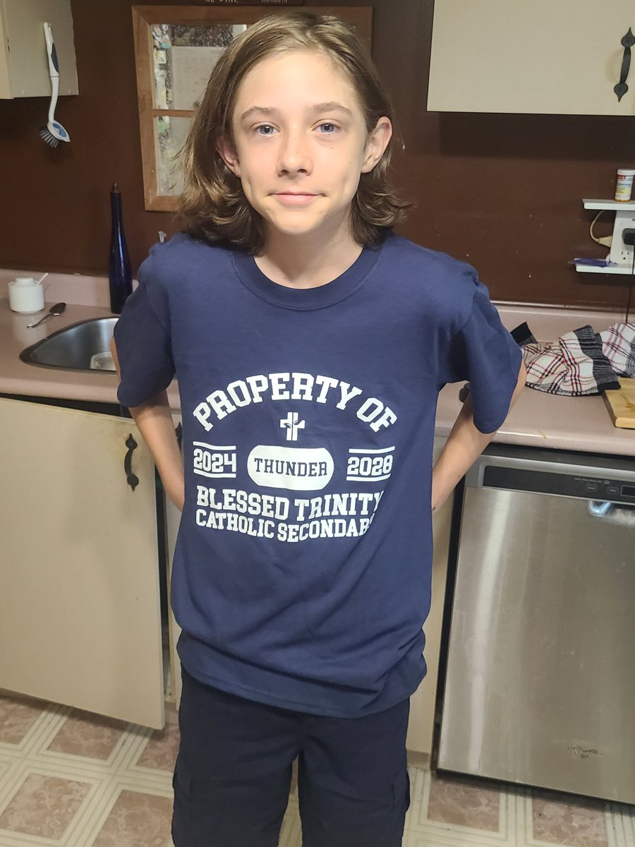 The smile is there with his first official <a href="/BTrinity3/">Blessed Trinity Catholic Secondary School</a> shirt! Ready to cheer on the Thunder football team today! <a href="/niagaracatholic/">Niagara Catholic DSB</a> <a href="/ncaa_niagara/">Niagara Catholic Athletic Association</a>
