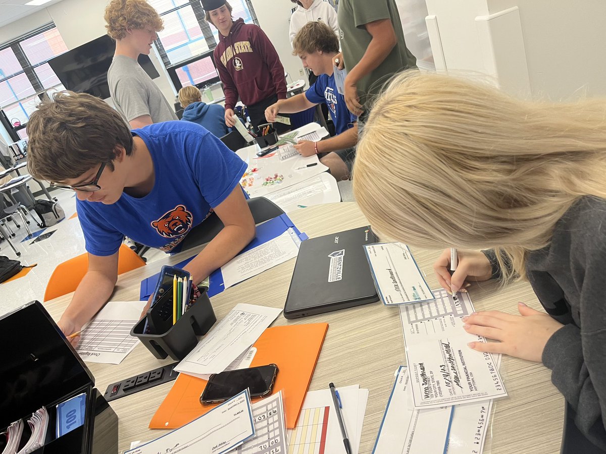 NPGrizBusiness's tweet image. Just checked out Mrs. Buford’s Personal Finance Class.  They are practicing writing deposit slips ✍️ and inserting money into a checking account. 💵 #NPObserveMe #NPGrizBiz