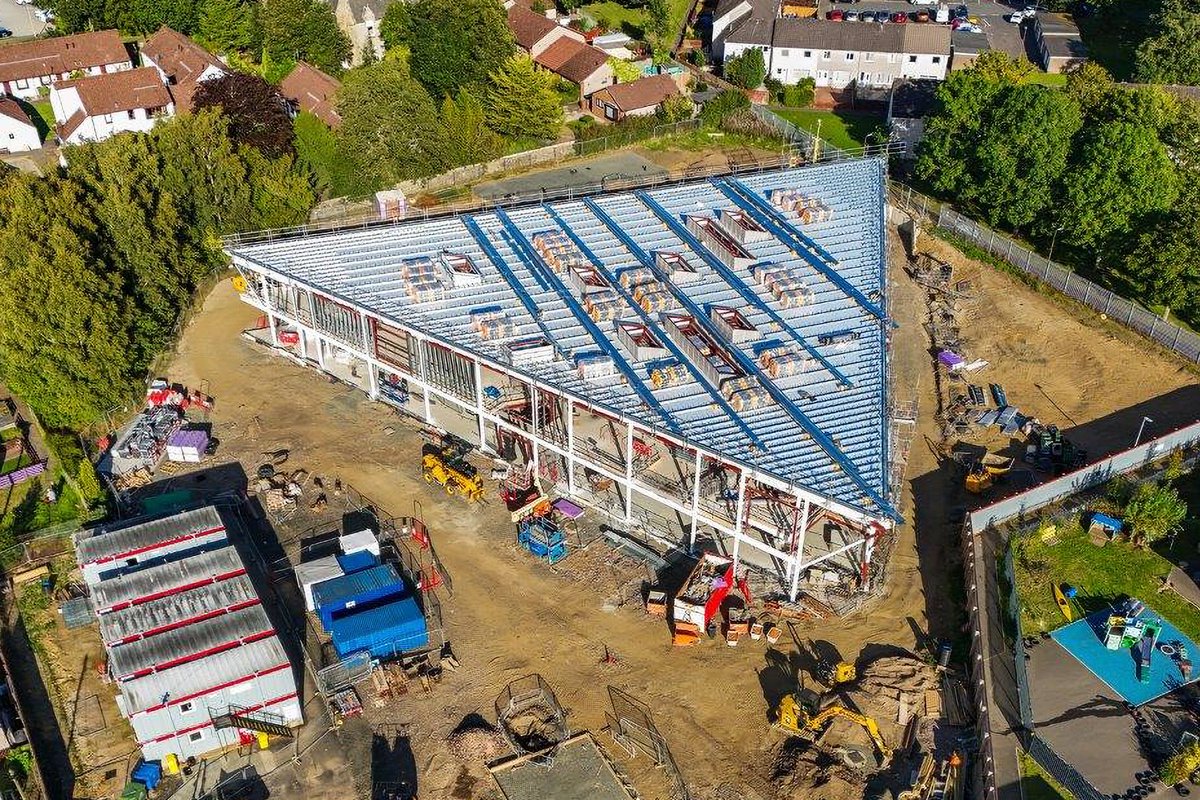 Fantastic to see drone shots from the site of the new @eastcalder_ps we're delivering for @LoveWestLothian. @morrisonbuilds is making good progress on site and the distinct triangular-shaped form, designed by Norr, is really taking shape🔺. #InspiringLearningEstate
