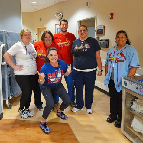 It's Well-being Wednesday in the middle of Employee Appreciation Week at SIU School of Medicine. The dress code today encouraged team apparel, and in the friendly confines of the (Ted) Simmons Cancer Institute, a lone Cub fan feels just fine amid her Cardinal colleagues.