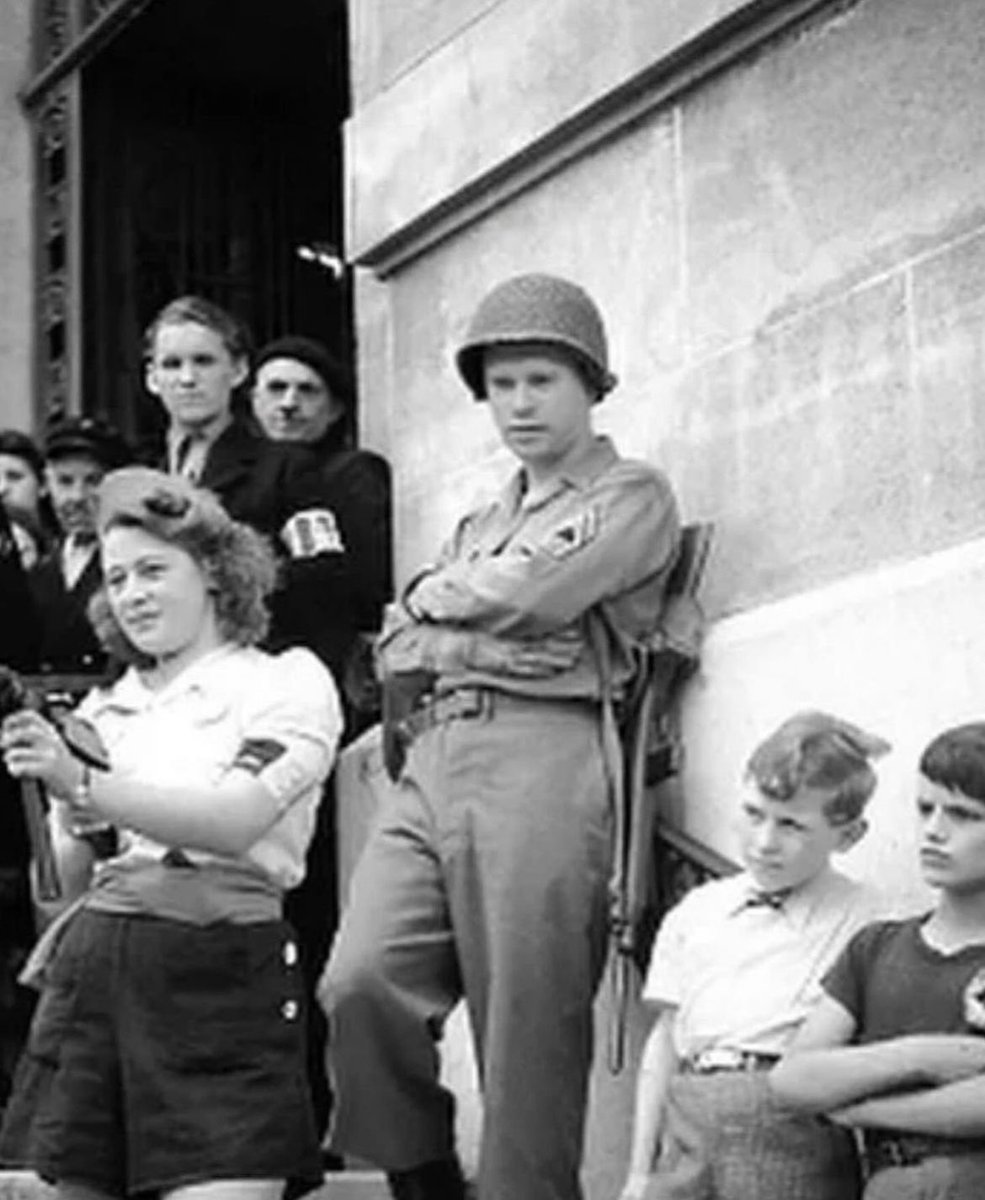 historyinmemes's tweet photo. Simone Segouin, mostly known by her codename Nicole Minet, was only 18 years old when the Germans invaded. Her first act of rebellion was to steal a bicycle from a German military administration and slice the tires of all the other bikes and motorcycles so they couldn't pursue her. She found a pocket of the Resistance and joined the fight, using the stolen bike to deliver messages between Resistance groups.

She was an extremely fast learner and quickly became an expert at tactics and explosives. She led teams of Resistance fighters to capture German troops, set traps, and sabotage German equipment. As the war dragged on, her deeds escalated to derailing German trains, blocking roads, blowing up bridges, and helping to create a German-free path to aid the Allied forces in retaking France from the inside. Remarkably, she was never caught.

Segouin was present at the liberation of Chartres on August 23, 1944, and then the liberation of Paris two days later. She was promoted to lieutenant and awarded several medals, including the Croix de Guerre. After the war, she studied medicine and became a pediatric nurse. She passed away in February 2023 at the age of 97.