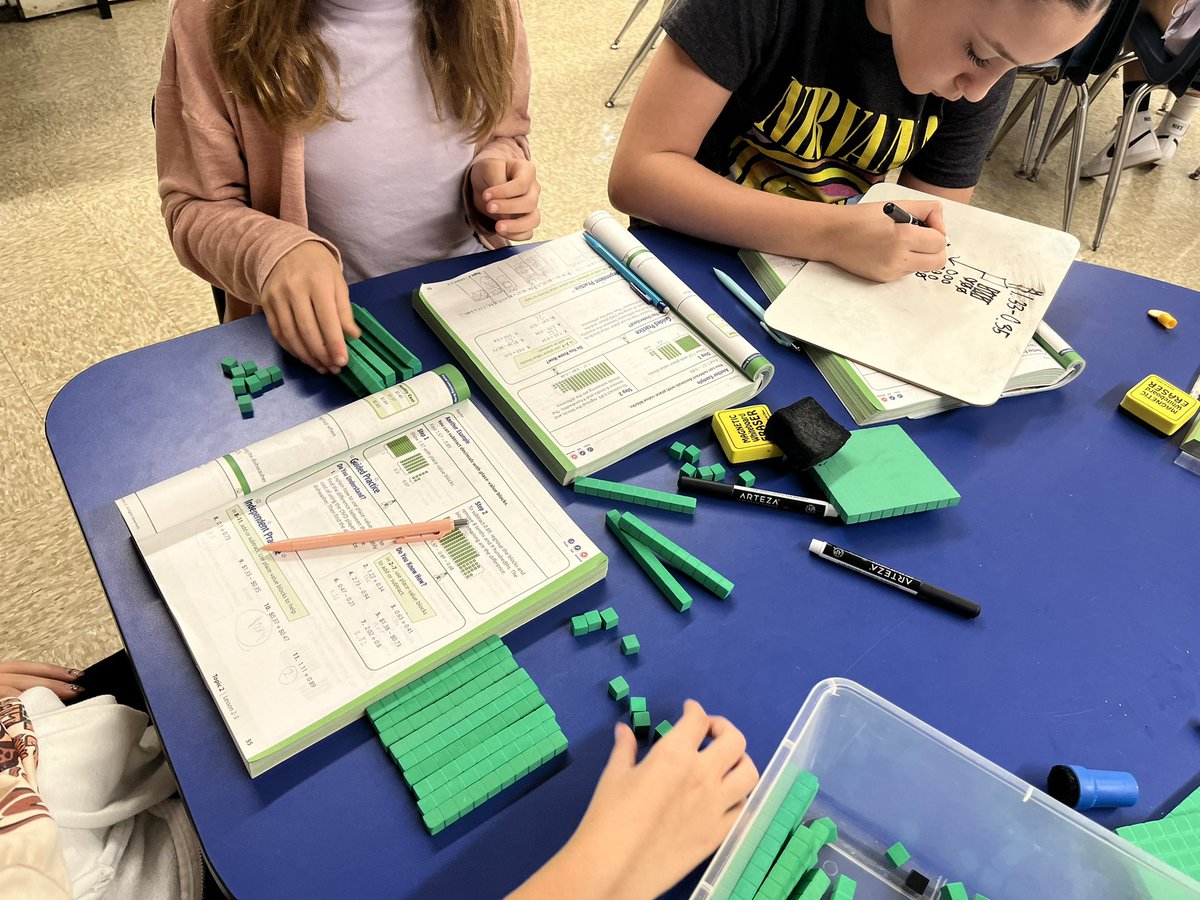 Students demonstrate adding and subtracting decimals using place value blocks!